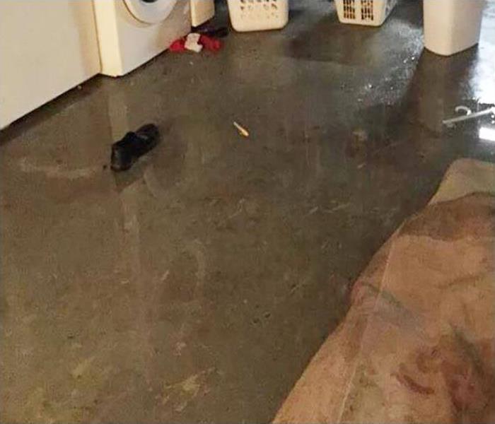 Laundry room suffers leak causing major water damage.